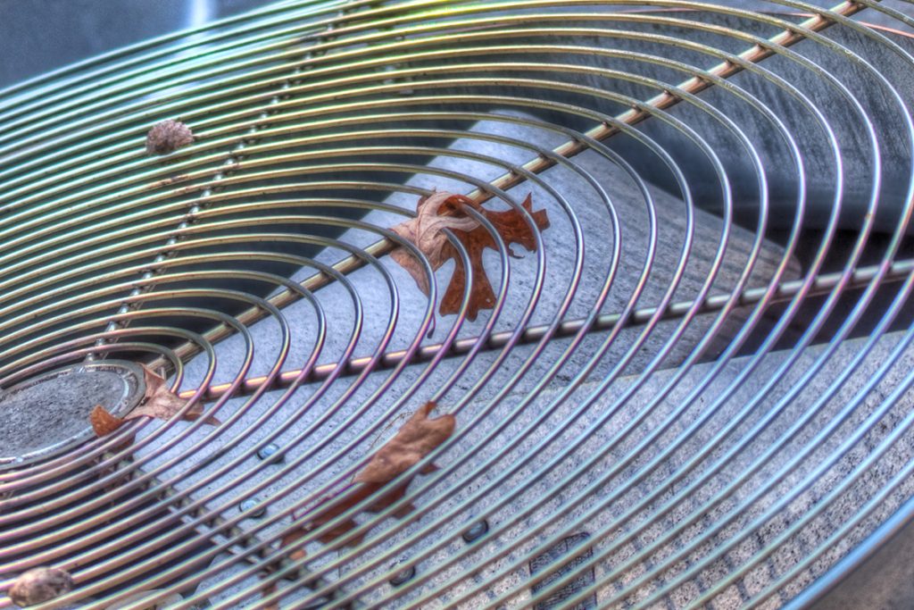 leaves stuck in air conditioner unit