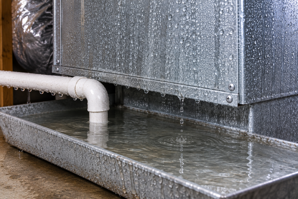 Excessive AC condensation during humid weather causing water to collect in the drain pan.